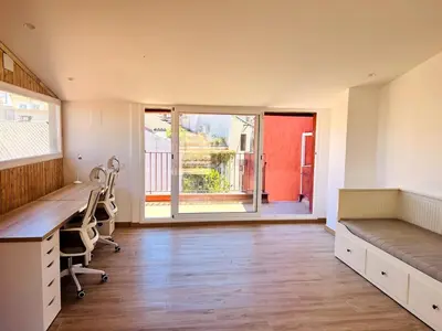 an office with a desk and a chair and a window at Large townhouse in St Cugat in Sant Cugat del Vallès