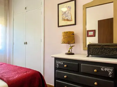 a bedroom with a dresser and a mirror at Tranquil Villa with Private Pool & views in Sant Cebrià de Vallalta