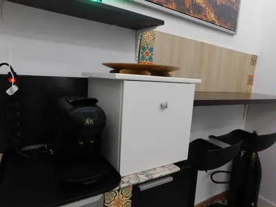 a kitchen with a black and white stove at A pasos de la playa en Barcelona! in Barcelona