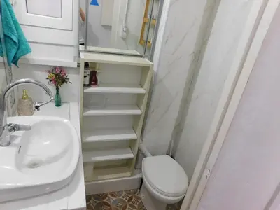 a bathroom with a toilet and a sink at A pasos de la playa en Barcelona! in Barcelona