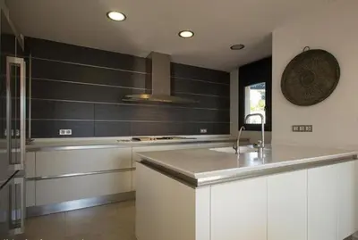 a kitchen with a sink and a counter top at El Desmai in San Pol de Mar