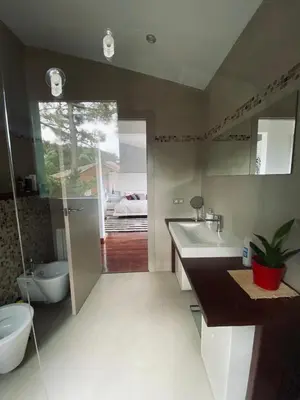 a bathroom with a sink and a toilet and a tub at El Desmai in San Pol de Mar