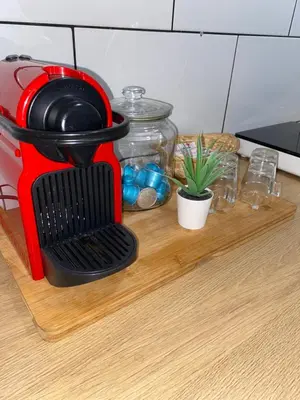 a red mixer sitting on top of a cutting board at Barcelona Home in Barcelona