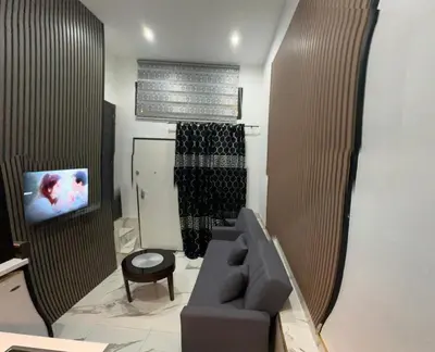 a bathroom with a glass shower with a toilet at Casa hamburg BCN in Badalona