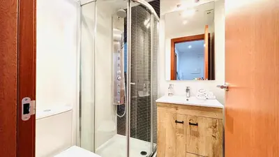 a bathroom with a shower and a sink at Bajos con jardín in Terrassa