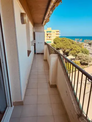 a balcony with a view of the ocean at Apartamento en 1ª línea con vistas al mar cerca de Barcelona in Pineda de Mar