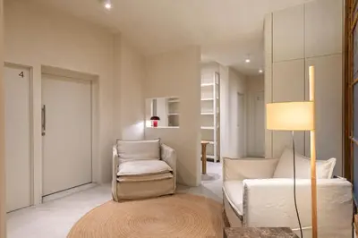 a living room with a couch and a chair at The Boulevard by Aspasios in Barcelona