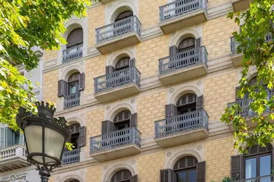 a building with balconies and a street light at The Boulevard by Aspasios in Barcelona