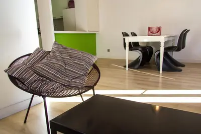 a chair with a pillow on top of a table at Housalia Ondina Suites Sagrada Familia in Barcelona