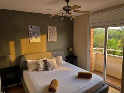 a bedroom with a bed with a ceiling fan at Villa Barcelona Experience Penedes Sitges Bliss with Private Pool in Can Trabal