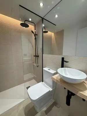 a bathroom with a toilet and a sink and a shower at Quiet Apartment in Sitges Center Steps from Beach in Sitges