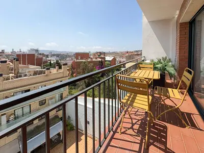 a balcony with a table and chairs on a building at Stay U-nique Apartments at Albigesos in Barcelona