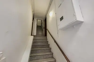 a stairway in a building with a stair case at Barcelona Touch Apartments - Creu dels Molers in Barcelona