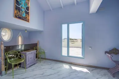 a room with a window and a desk and a chair at Can cruspinera WITH 6BEEDROOM in Tiana