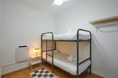 a bedroom with two bunk beds in a room at Park Guell in Barcelona