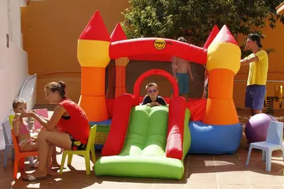a group of people playing with an inflatable play structure at Hotel Bon Repos in Calella