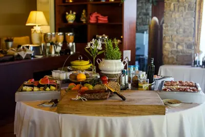 a table with a buffet of fruits and vegetables at Mas de la Sala in Sallent del Llobregat