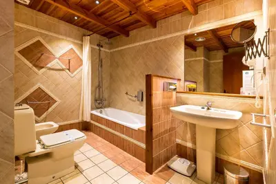 a bathroom with a sink and a toilet and a tub at Mas de la Sala in Sallent del Llobregat