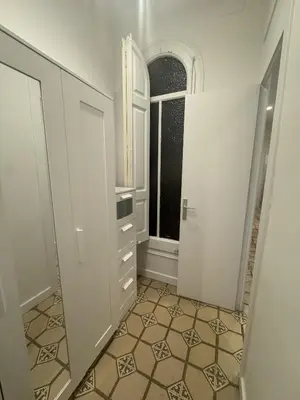 a bathroom with a mirror and a door with a window at The Perfect Nomad's Home - Barcelona in Barcelona