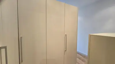 a pair of white cabinets in a room at Opening Doors Summer Chic in Barcelona