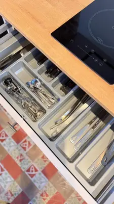 an open drawer in a kitchen with utensils at Two bedrooms bright apartment center Barcelona in Barcelona