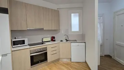 a kitchen with a sink and a microwave at Opening Doors Sant Pau II Centric AACC in Barcelona