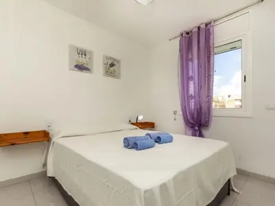 a bedroom with a bed with two towels on it at Apartment Bahia by Interhome in Cunit