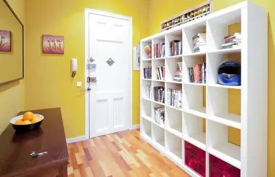 a room with a book shelf with books at Barcelona - Provença in Barcelona