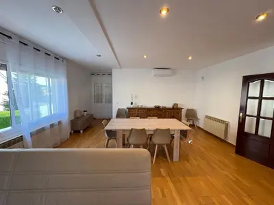 a living room with a table and a couch at casa en Palau in Palau-Solità i Plegamans