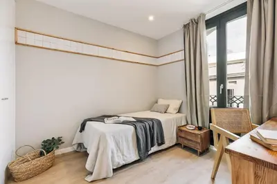 a white kitchen with a washing machine in it at Agropoli - 2 bedrooms and terrace in Ciutat Vella in Barcelona