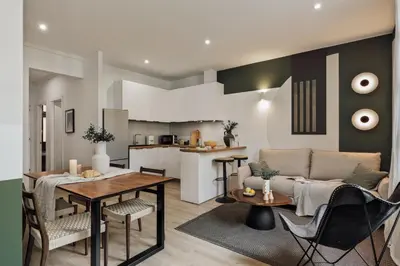 a kitchen and a living room with a table in a kitchen at Cinar - 2 bedrooms and balcony in Sant Antoni in Barcelona