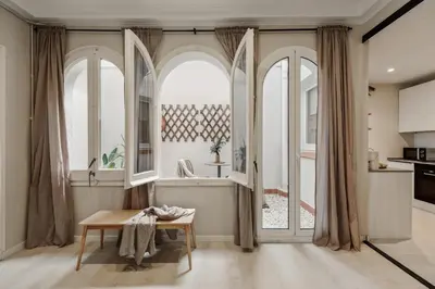 a dining room with a table and chairs at Cember - 3 bedrooms and patio in Sant Gervasi in Barcelona