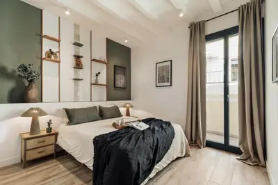 a living room with a couch and a table at Orosi - 2 bedrooms and balcony in Poble Sec in Barcelona