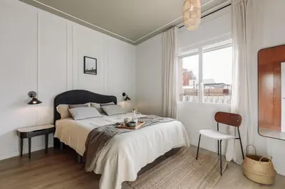 a living room with a couch and chairs and a tv at Serralada - 4 bedrooms and terrace in Sant Gervasi in Barcelona