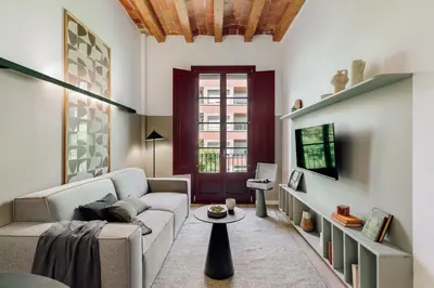 a kitchen and dining room with a table and chairs at Estiu - 2 bedrooms and balcony in Sant Antoni in Barcelona