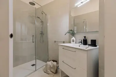 a bedroom with a desk and a table and chairs at Hidiv - 3 bedrooms and terrace in Eixample Dreta in Barcelona