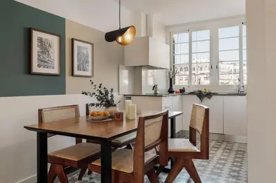 a white bathroom with a sink and a toilet at Lygos - 2 bedrooms and terrace in Eixample Esquerra in Barcelona