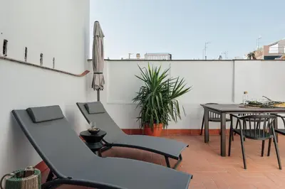 a white bathroom with a sink and a shower at Lygos - 2 bedrooms and terrace in Eixample Esquerra in Barcelona