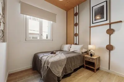 a living room with a couch and a table at Arenal - 3 bedrooms and terrace in Sarrià in Barcelona