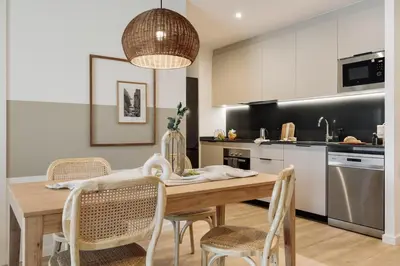 a bedroom with a bed and a large window at Blava - 2 bedrooms in Sant Antoni in Barcelona
