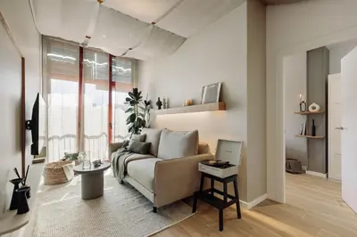 a kitchen with a table and a dining room at Blava - 2 bedrooms in Sant Antoni in Barcelona