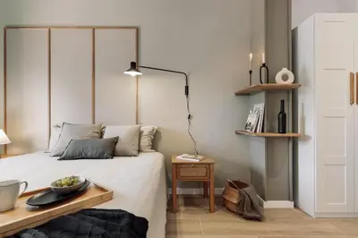a bedroom with a bed and a desk and a chair at Blava - 2 bedrooms in Sant Antoni in Barcelona