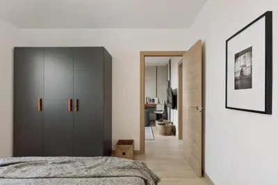 a kitchen with white cabinets and a stainless steel refrigerator at Llaberia - 2 bedrooms in Sant Gervasy in Barcelona