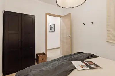 a bedroom with a bed with a black blanket on it at Llaberia - 2 bedrooms in Sant Gervasy in Barcelona