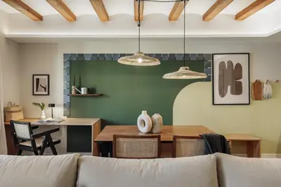 a dining room with a table and two lights at Izmit - 2 bedrooms and balcony in Sant Pere in Barcelona