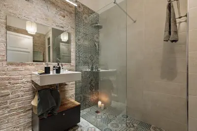 a bedroom with a large bed with a large window at Morell - 3 bedroom and office in Eixample Esquerra in Barcelona