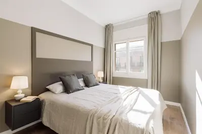 a living room with a couch and a table at Morell - 3 bedroom and office in Eixample Esquerra in Barcelona