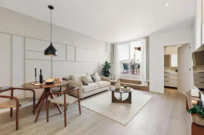 a bedroom with a large bed and a dining room at Isola - 1 bedroom and terrace in Eixample Dreta in Barcelona