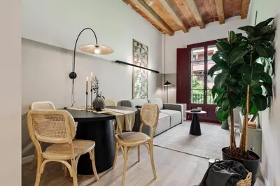 a living room with a flat screen tv on a wall at Xelida - 2 bedrooms and balcony in Sant Antoni in Barcelona
