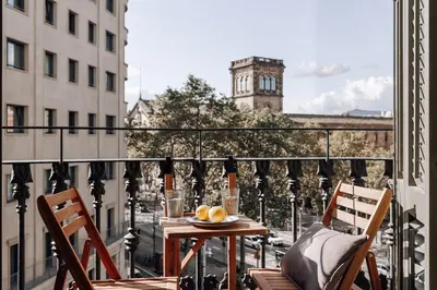 a bedroom with a large bed and a large mirror at Algar - 1 bedroom and balcony in Eixample Esquerra in Barcelona